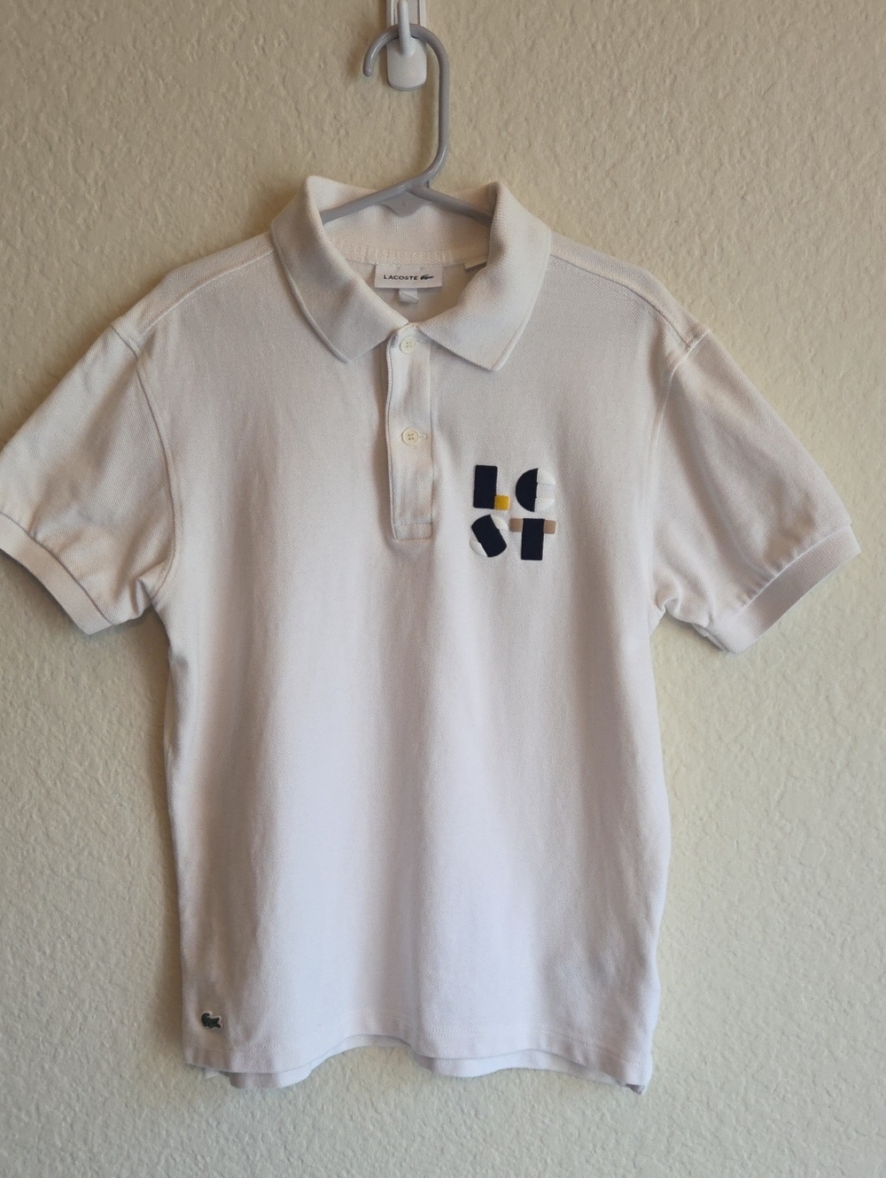 Lacoste White Polo with Navy and Yellow Graphic